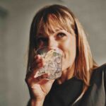 Woman drinking sparkling water