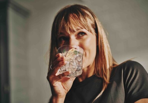 Woman drinking sparkling water