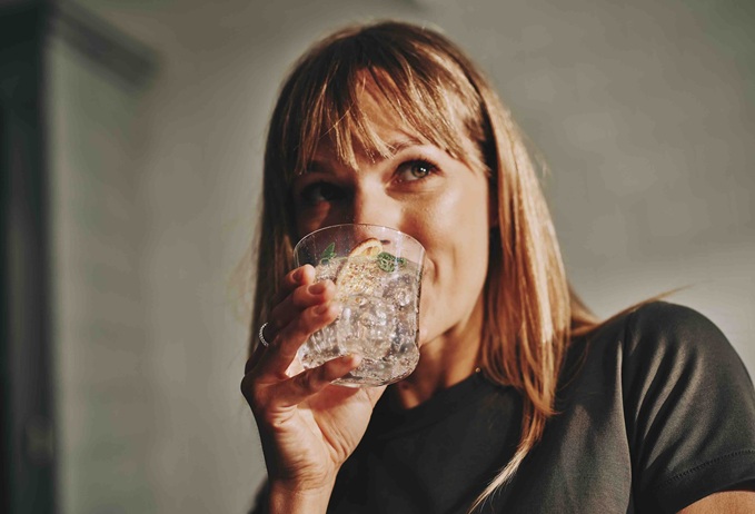 Woman drinking sparkling water